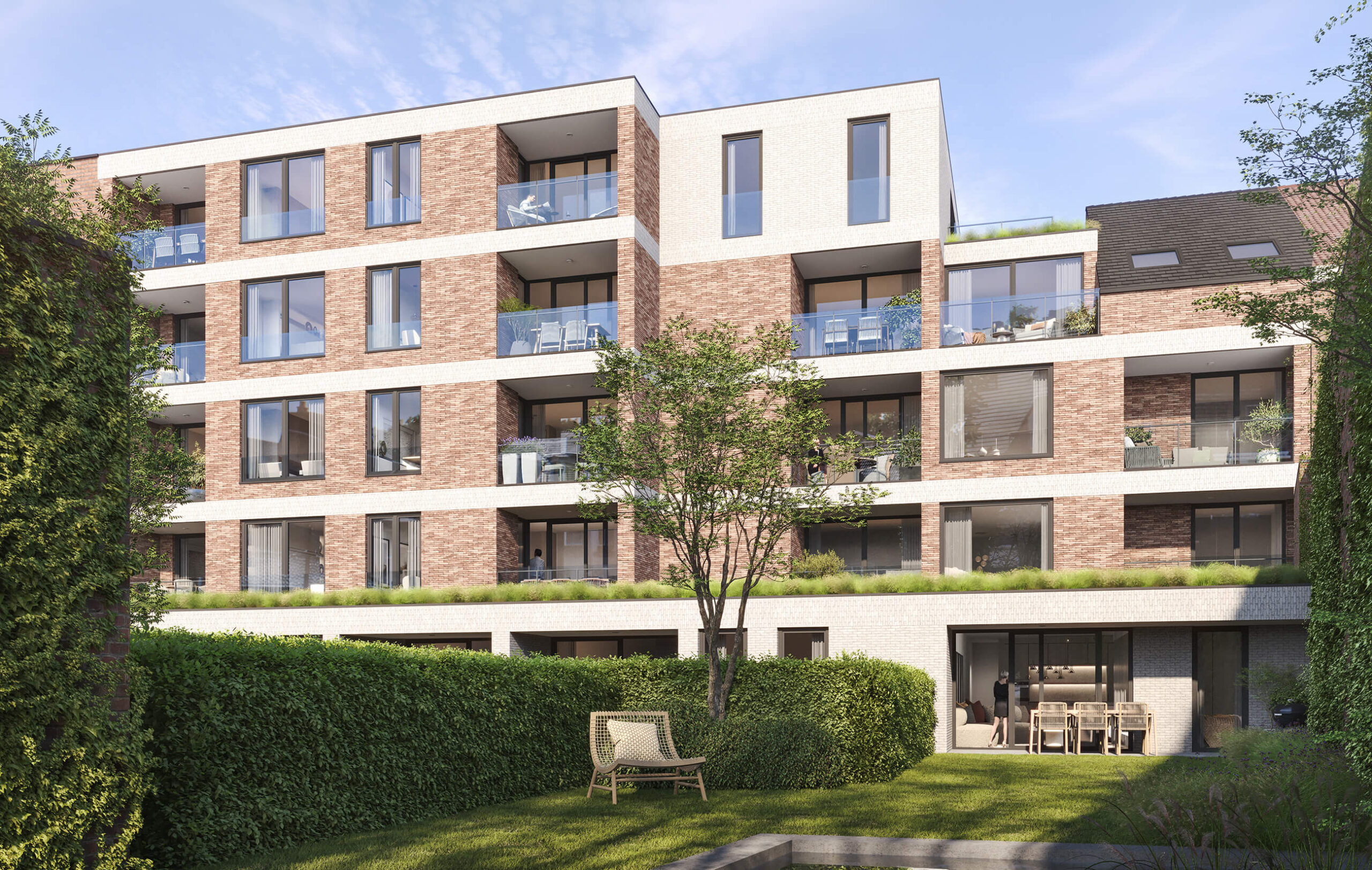 Zicht op achtergevel en tuin van Residentie Jena-Lou